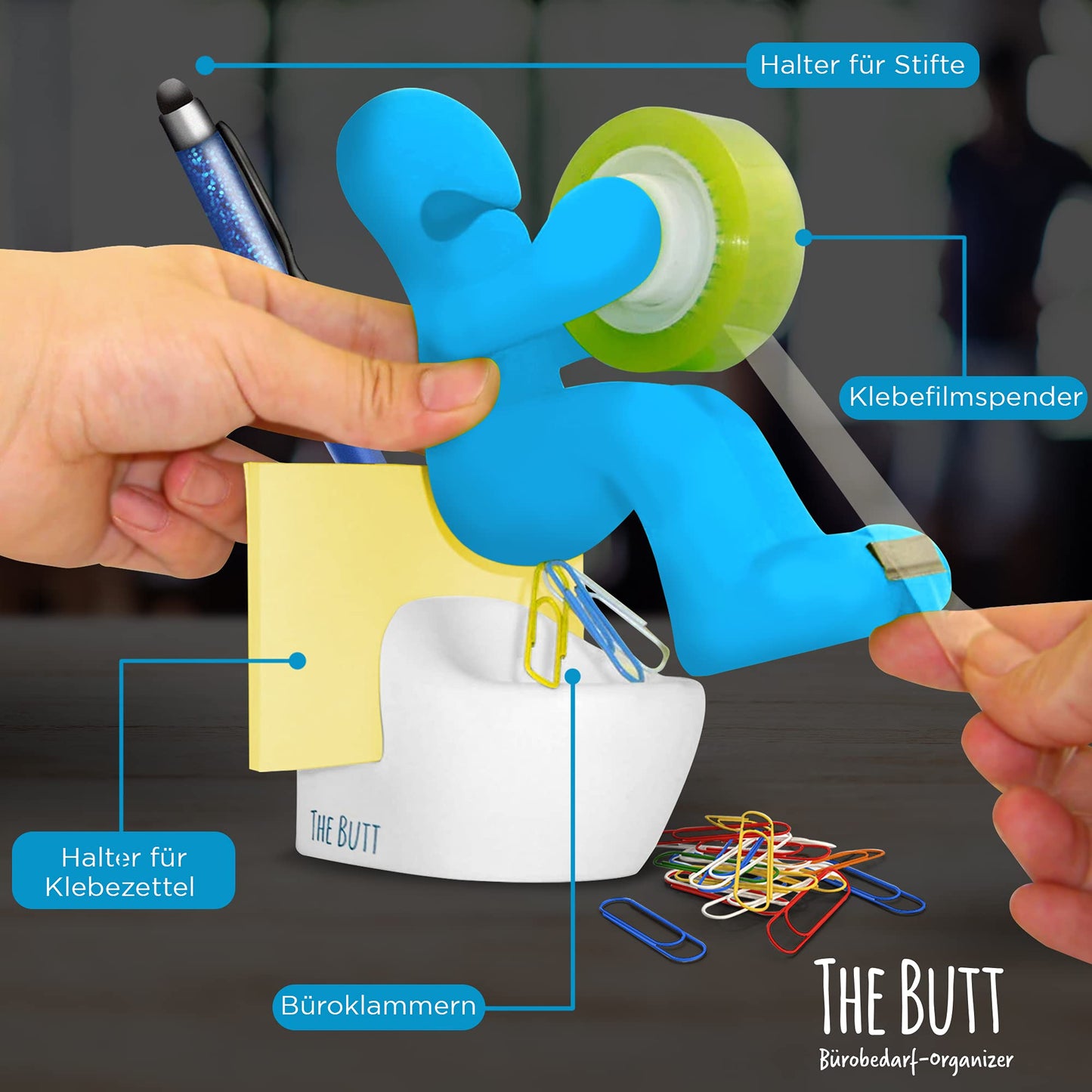 Desk organizer with adhesive tape dispenser, pen, paper clips and sticky notes